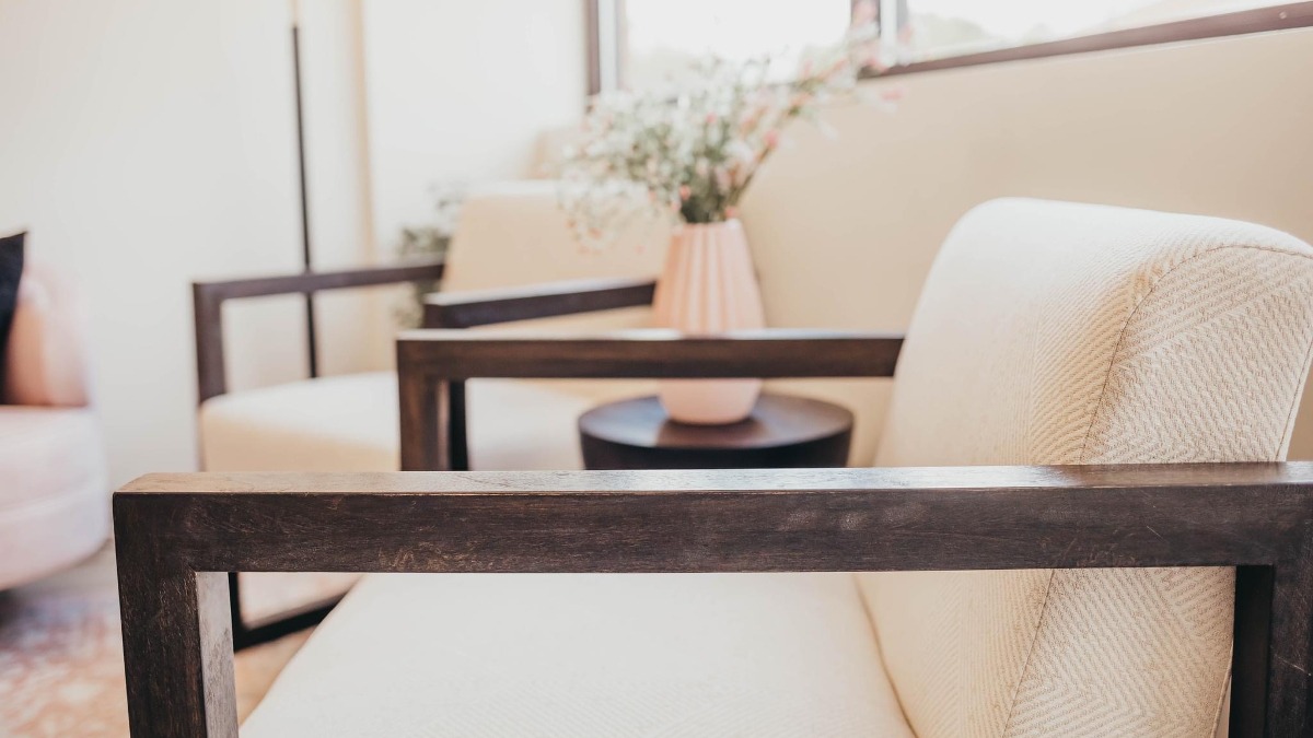 Closeup of two light beige chairs